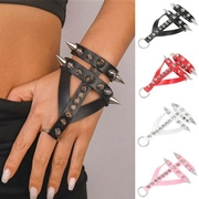Detail view of multi-color punk bracelets featuring metal rivets and sharp spikes