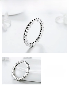 Macro shot of S925 silver ring featuring Forever Love engraving and heart details