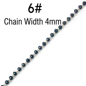 Detail showing 4mm wide black crystal bead chain with golden stainless steel links
