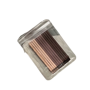 Set of brown gradient wave hair clips in a transparent pouch on a white background