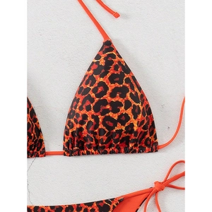 Detailed view of orange leopard print bikini featuring tie-up straps and triangle top