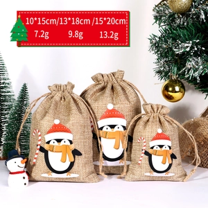 Three sizes of Christmas linen drawstring bags with cute penguin prints and holiday decor