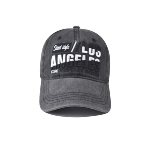 Close-up of the vintage washed dark grey Los Angeles embroidery on a denim baseball cap