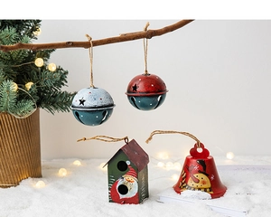 Close-up of decorative iron Santa and snowman bells with rustic twine hanging loops