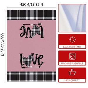 Macro detail of fade-resistant pink heart dish towel with stitched edges and size specs