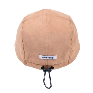 Light khaki suede camper hat with rear drawstring adjustment and Nece Ssary woven label