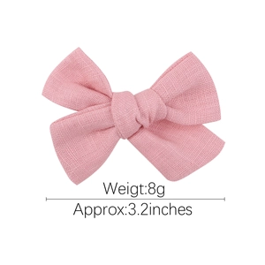 Pink lace embroidery bow hair clip for children made of textured linen cotton fabric