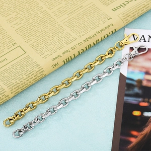 Detail of gold and silver O-link chains with rotating metal lobster clasps