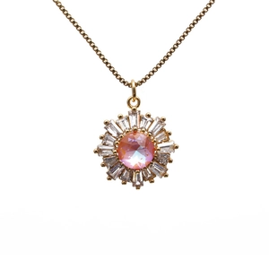 Golden sunflower necklace with pink gemstone and zircon crystals on a minimalist chain