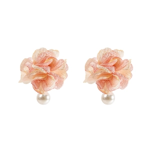 Detail of pink lace flower earrings featuring soft gradient tulle and elegant white pearls