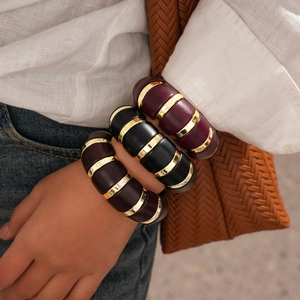 Chunky acrylic oval stretch bracelets in dark purple and brown with gold metal rings