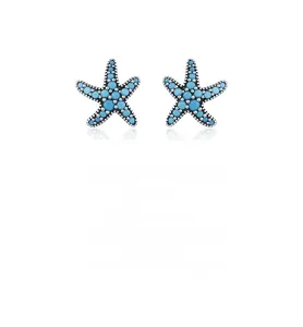 Macro detail of S925 sterling silver starfish stud earrings with turquoise stones