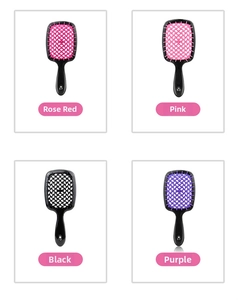 Detail of four colorful honeycomb vented hair brushes for quick blow-drying and styling