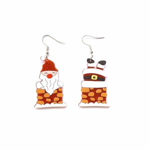 Detail of glitter acrylic Santa chimney earrings with creative cartoon design for Christmas
