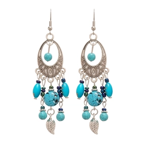 Bohemian silver earrings with oval turquoise beads and delicate leaf tassels on white background