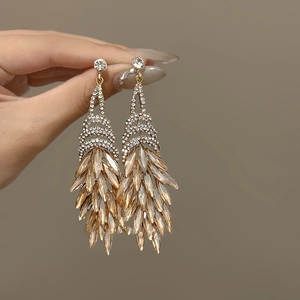 Exaggerated diamond rhombus drop earrings with amber crystals and gold finish