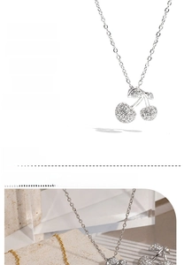 Macro detail of high-quality stainless steel cherry pendant with inlaid zircon stones