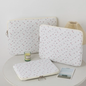 Three-piece set of quilted cherry print laptop sleeves with top zip and metal sliders