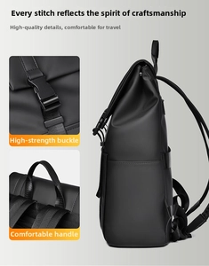 Detail view of durable buckle closure and reinforced handle on black business backpack