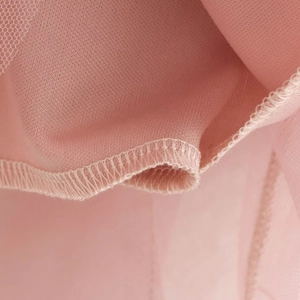 Pink tiered mesh tulle skirt featuring layered fabric and professional hemline stitching