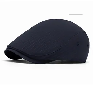 Detail of navy blue beret with fine vertical stripes and metal side ventilation eyelet