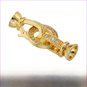 Macro shot of 11mm by 28mm gold plated heart clasp with pavé cubic zirconia