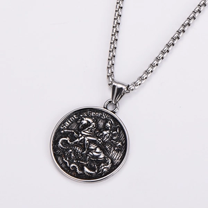 Detailed close-up of Saint George knight engraving on silver stainless steel pendant
