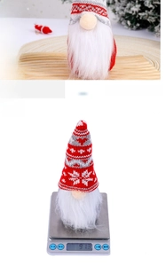 Detailed close-up of a Christmas gnome with a red knit hat showing its weight on a scale