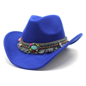 Detail of blue western cowboy hat featuring bohemian beads and turquoise centerpiece