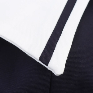 Close-up of white lapel collar with black stripe trim on casual summer dress