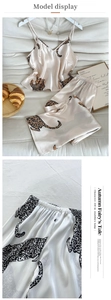 Detailed view of champagne leopard print satin pajama set showing waist and fabric texture