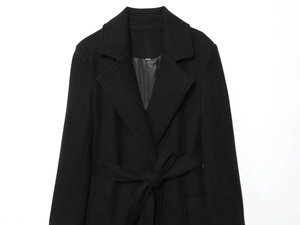 Detail of wool blend coat texture with classic notched lapel and matching waist tie