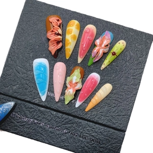 Tropical dopamine press-on nails with 3D embossed flowers and vibrant stiletto art