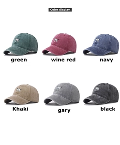 Color display of washed cotton baseball caps with dog embroidery in six diverse colors