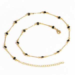 Detail of 18K gold-plated copper chain with black round gemstones and lobster clasp