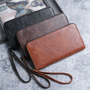 Three men's long zip wallets in black and brown leather with retro wrist straps