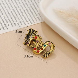 Detailed size view of vintage gold dragon brooch with colorful rhinestones, 3.1x1.8cm