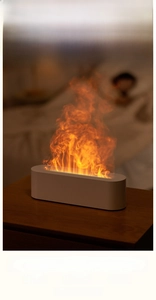 Close-up of flame aroma diffuser showing quiet 50-60dB operation in bedroom setting