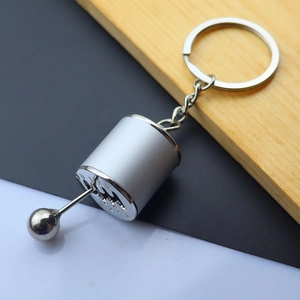 Detail of 6-speed manual gearbox gear shifter keychain in matte and polished silver finish