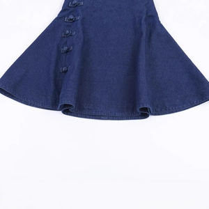Fashionable dark blue denim cape top featuring traditional Chinese knot button details