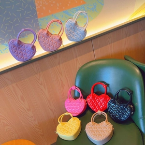 Close-up of heart-shaped quilted jelly bags in various colors like pink and purple