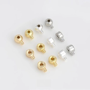Polished gold and silver DIY jewelry slider beads displayed in a matrix layout