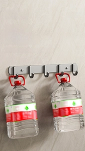 Gray wall-mounted rack with 5 hooks showing heavy weight capacity for bathroom use