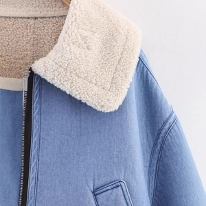 Blue denim jacket with warm white fleece collar and metal zipper closure for winter