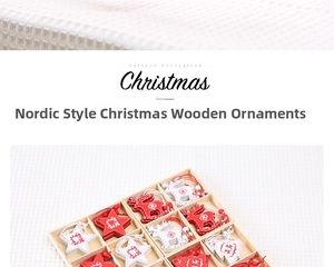 Detailed view of red and white wooden Christmas star and deer ornaments in a gift box