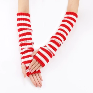 Detail of red and white striped knitted arm warmers on model against white background