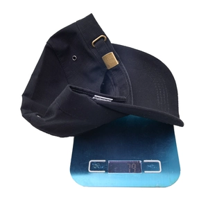 Lightweight black tactical camo flat top cap on a scale showing 79g weight detail