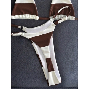 Close-up of brown striped bikini with metal rings and high-elasticity fabric texture