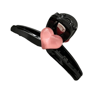 Pink heart mini hair claw clip in black plastic finish for girls' side fringe styling