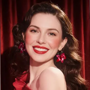 Retro resin flower C-shape dangle earrings with red petals on a smiling model